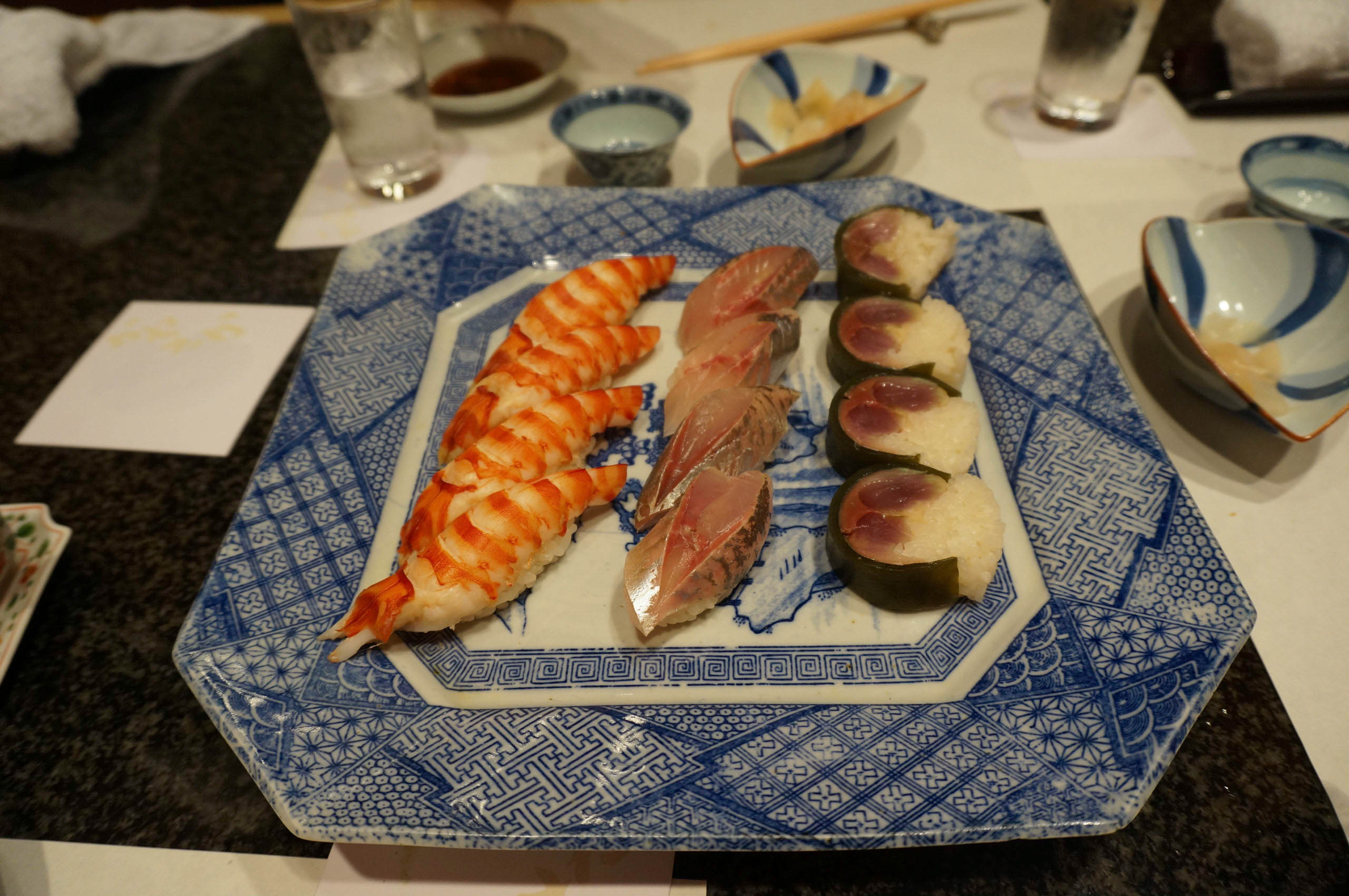 Shrimp and Anchovy Sushi accompanied by a unique Tuna Roll