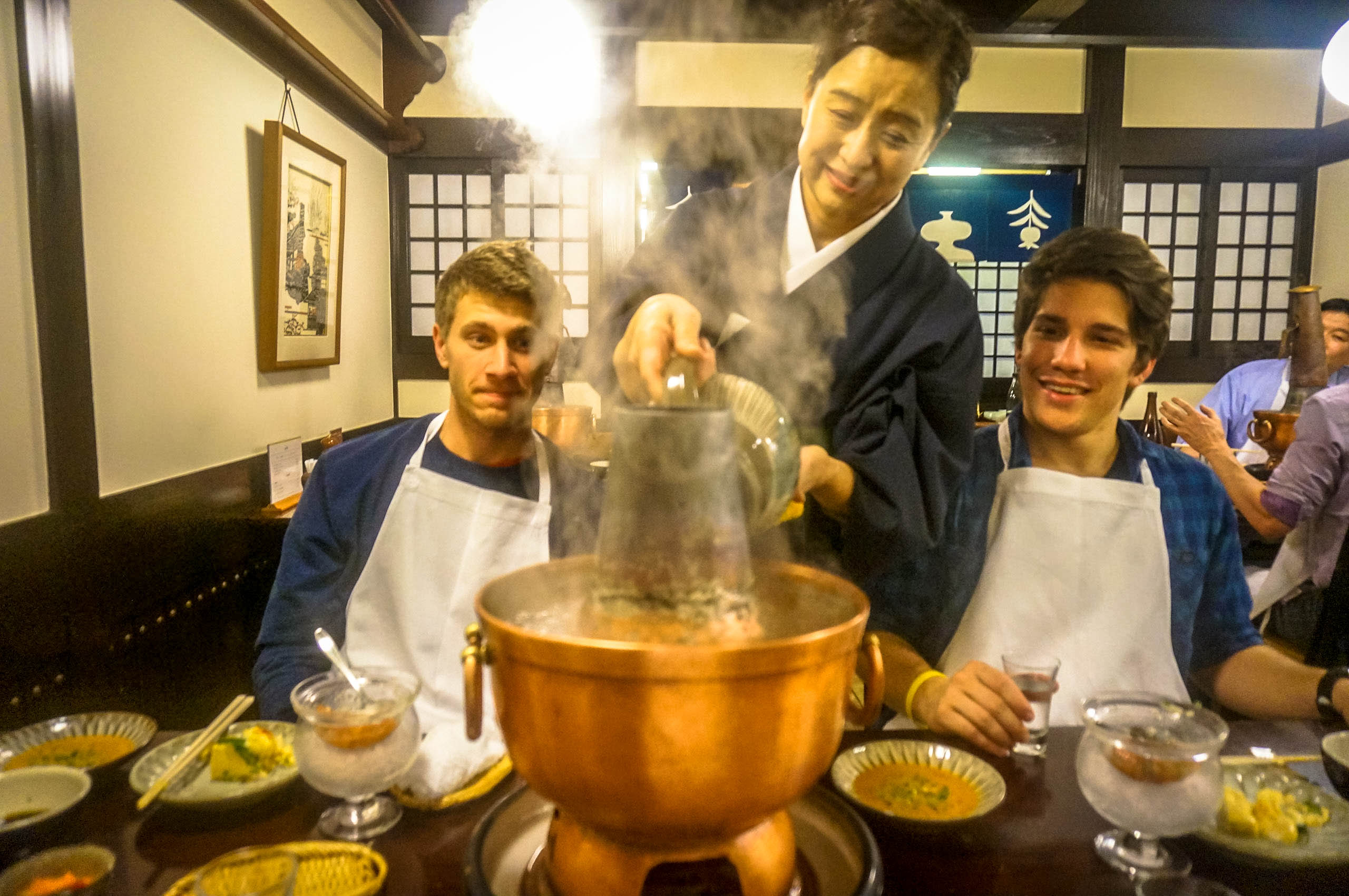 Waitress tending to the famous Shabu Shabu broth